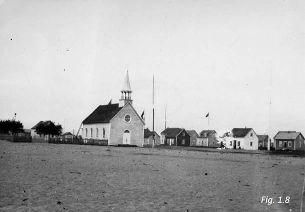 Photograph of a chapel and a number of Innu houses

Photograph of the Chapel of the Sacred Heart of Jésus and part of the Innu village, Seven Islands, 1913, P-66, tab 258.
